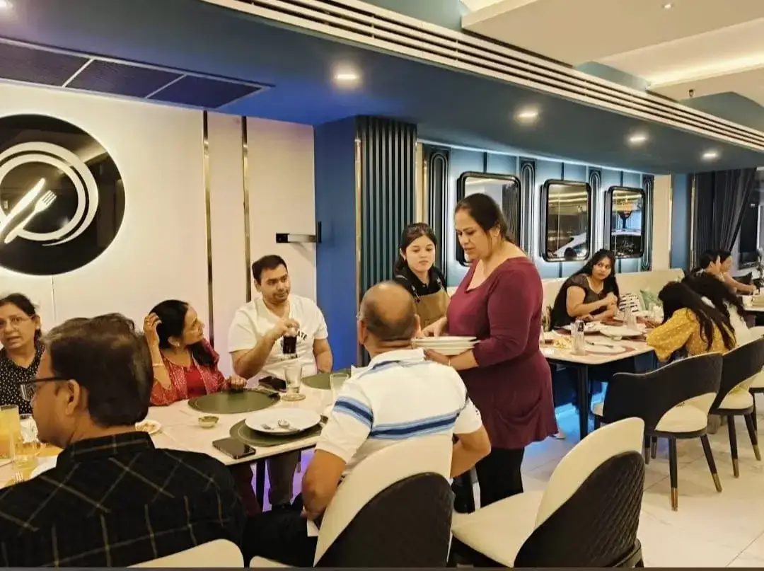 Guests enjoying cocktails and mocktails at modern bar